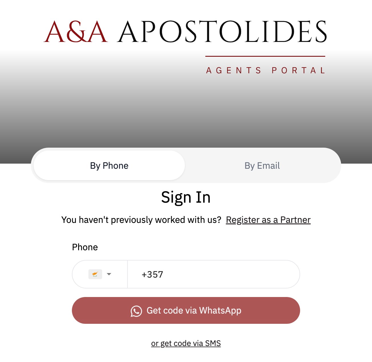 Agent Portal sign-in: By Phone and By Email tabs, a Register as a Partner link, a phone field with Get code via WhatsApp, or a code by SMS