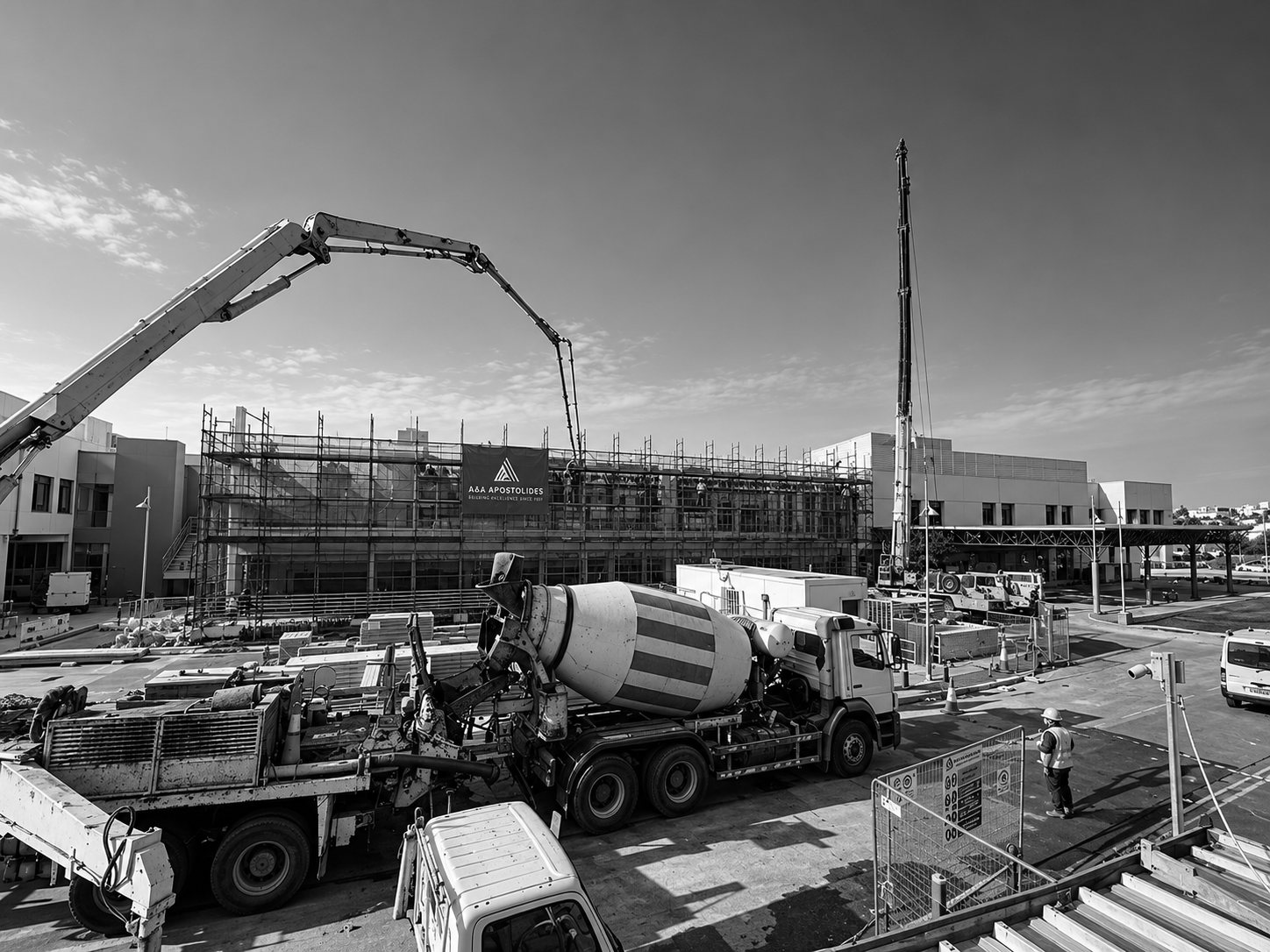 An A&A Apostolides building site: cranes and a concrete pump